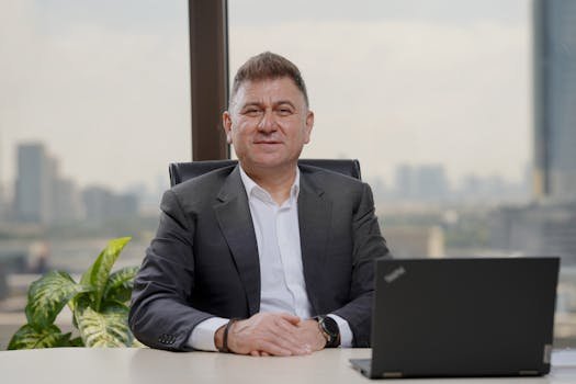 Confident middle-aged businessman in an elegant office with city view.